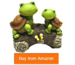 two turtles on a log statue